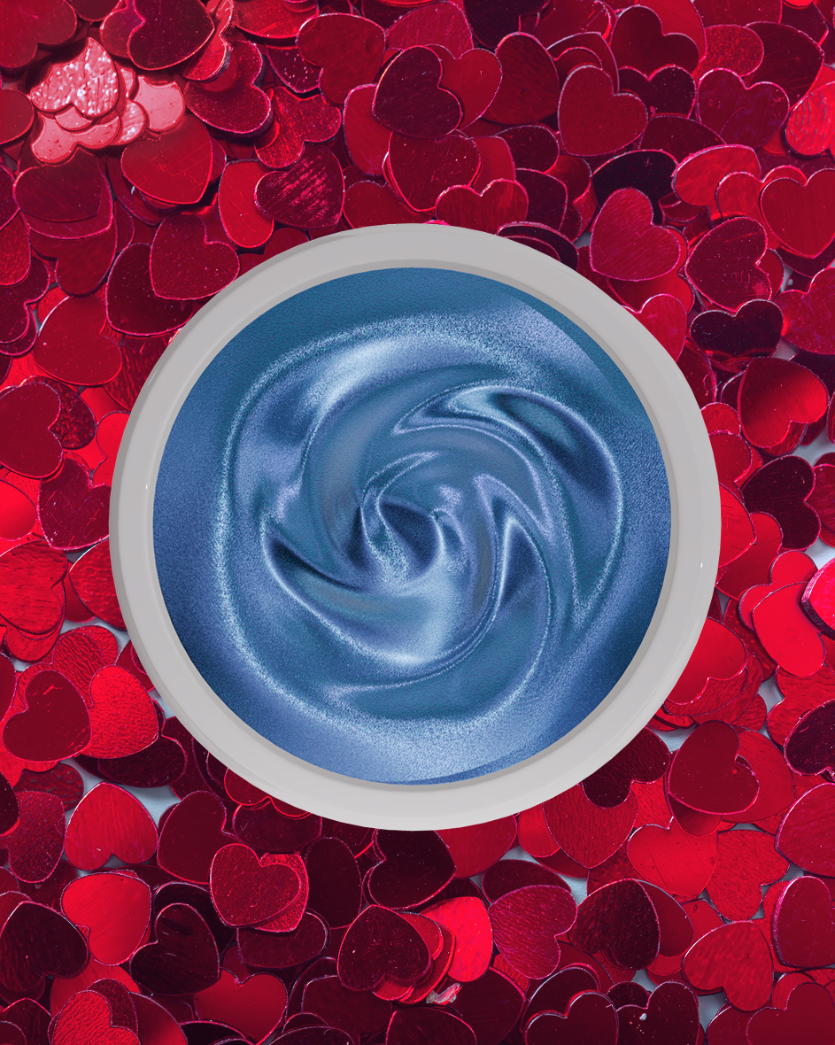 Blue cream pigment on red sparkle background