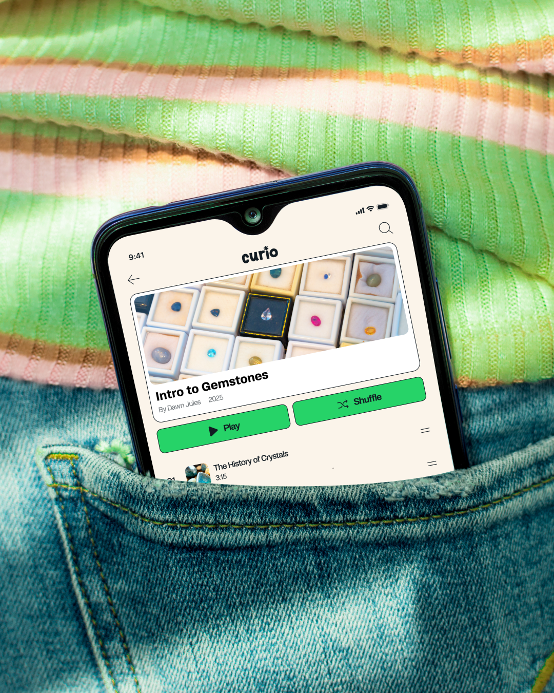 Cellphone in jean pocket showing the curio app on screen
